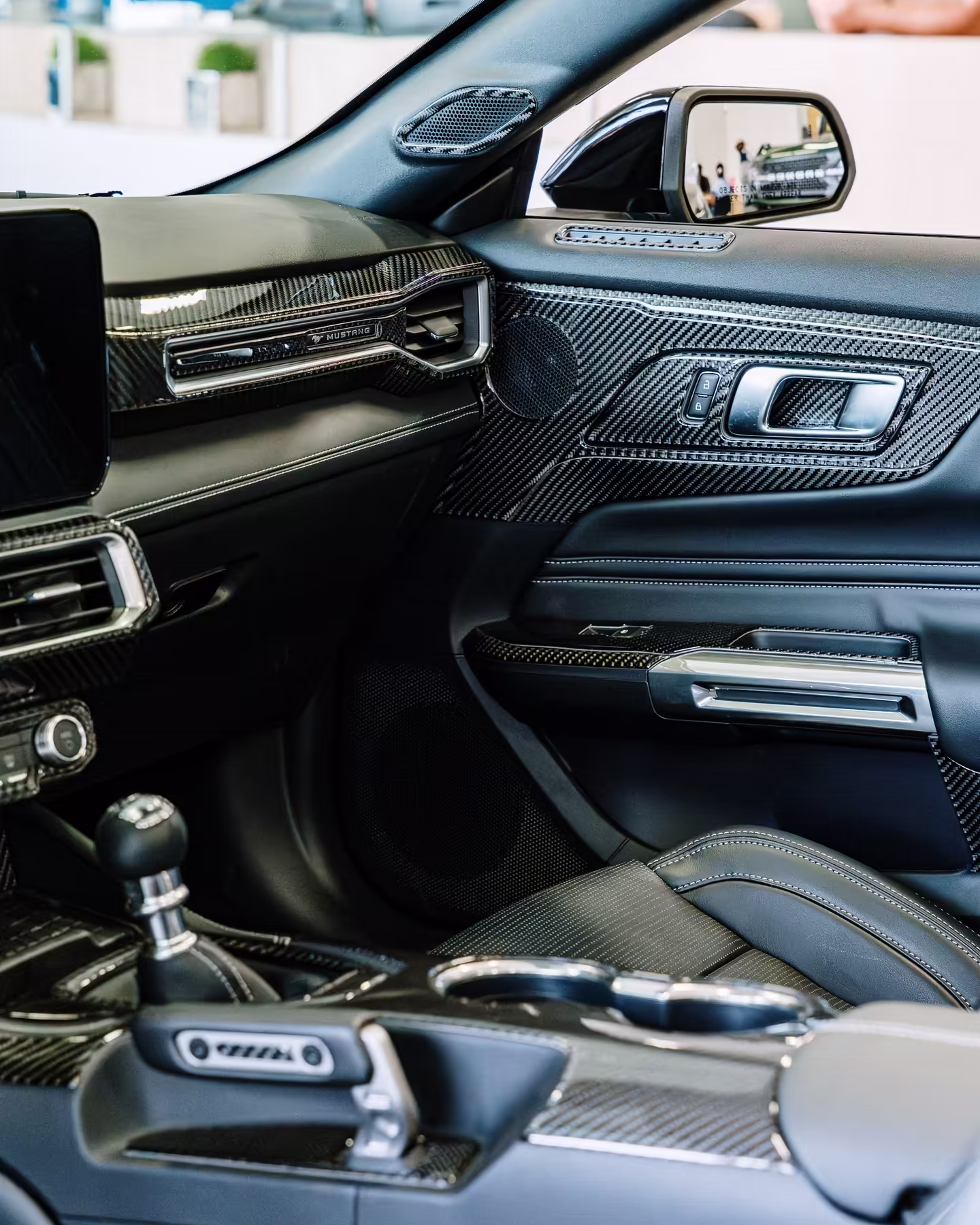 Close-up of installed carbon fiber product showing detail and quality